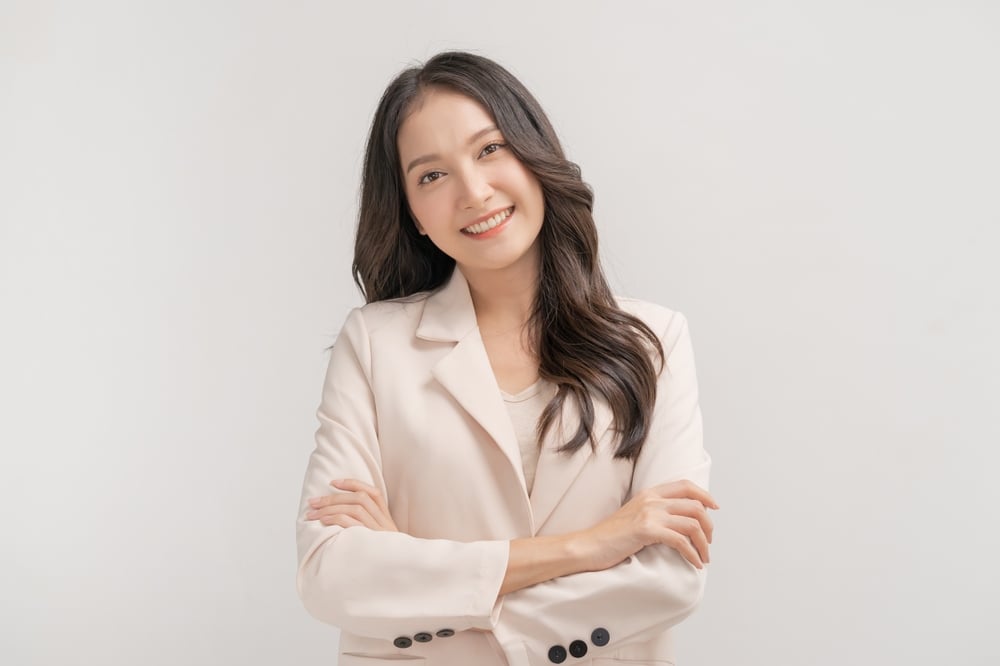 Smiling,Positive,,Attractive,Asian,Young,Woman,,Girl,In,Beige,Suit